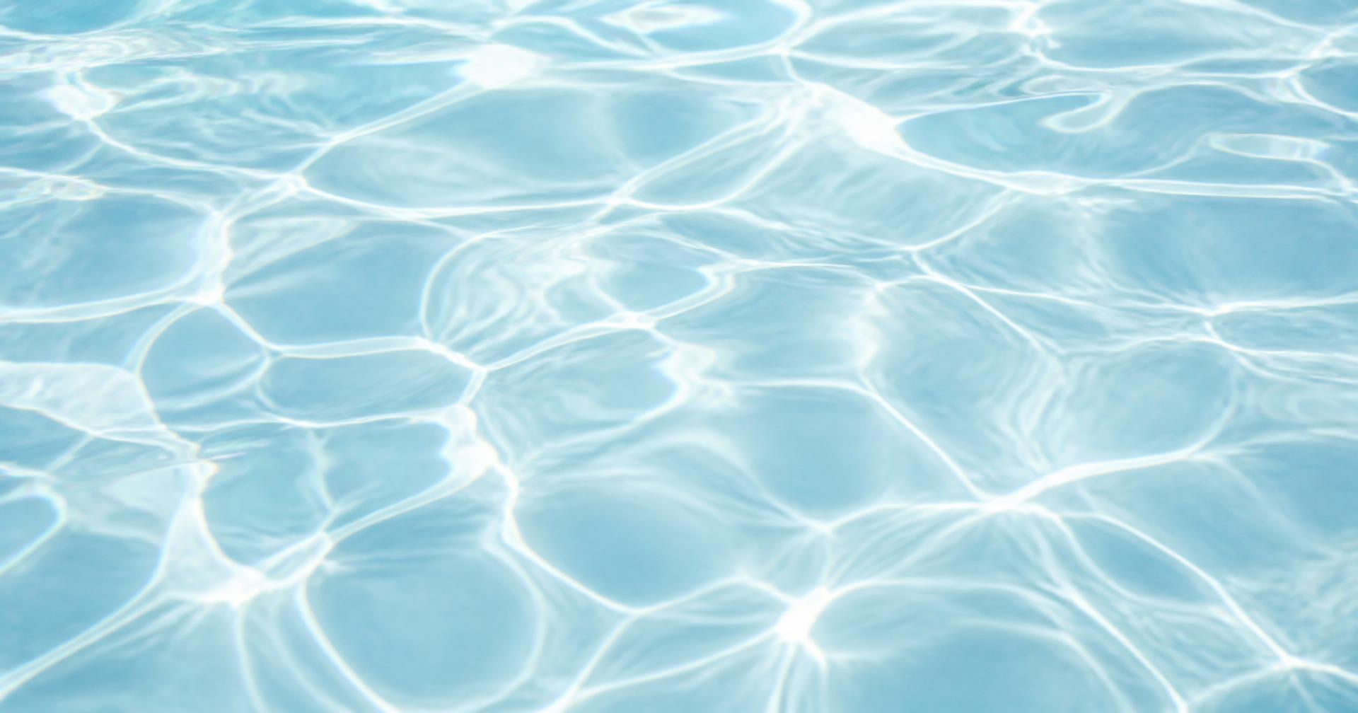 Sunlight refracting through clear, moving water